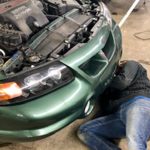 person working on car